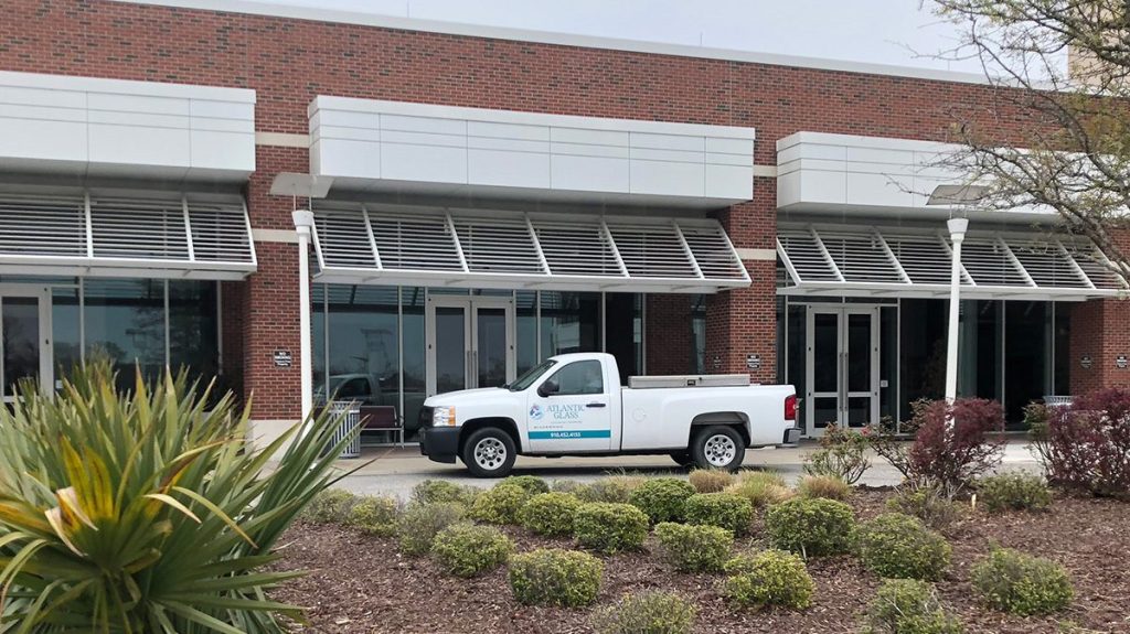 The Atlantic Glass office exterior with a company pickup parked outside