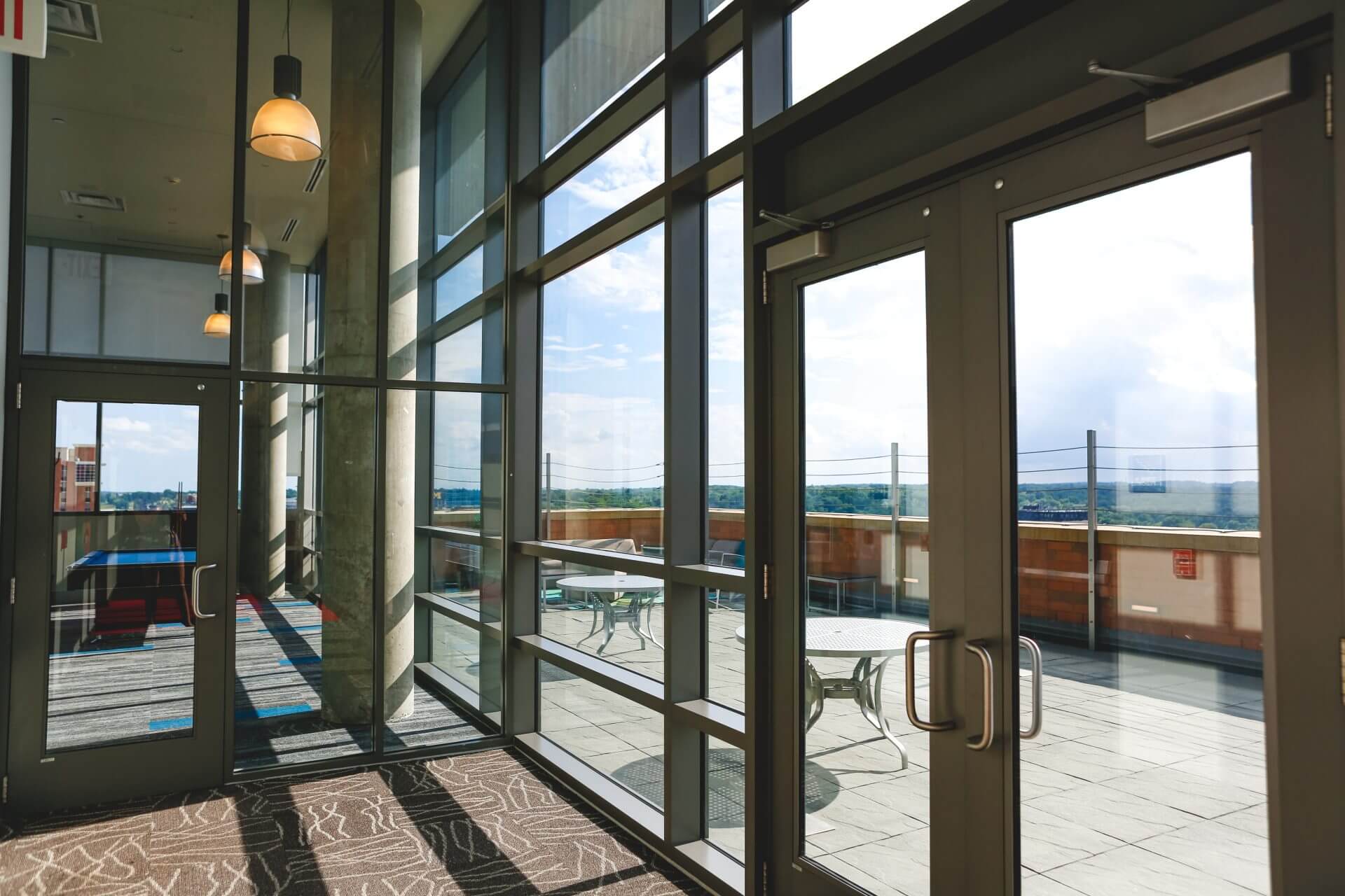 Sliding glass doors opening from a room onto a terrace