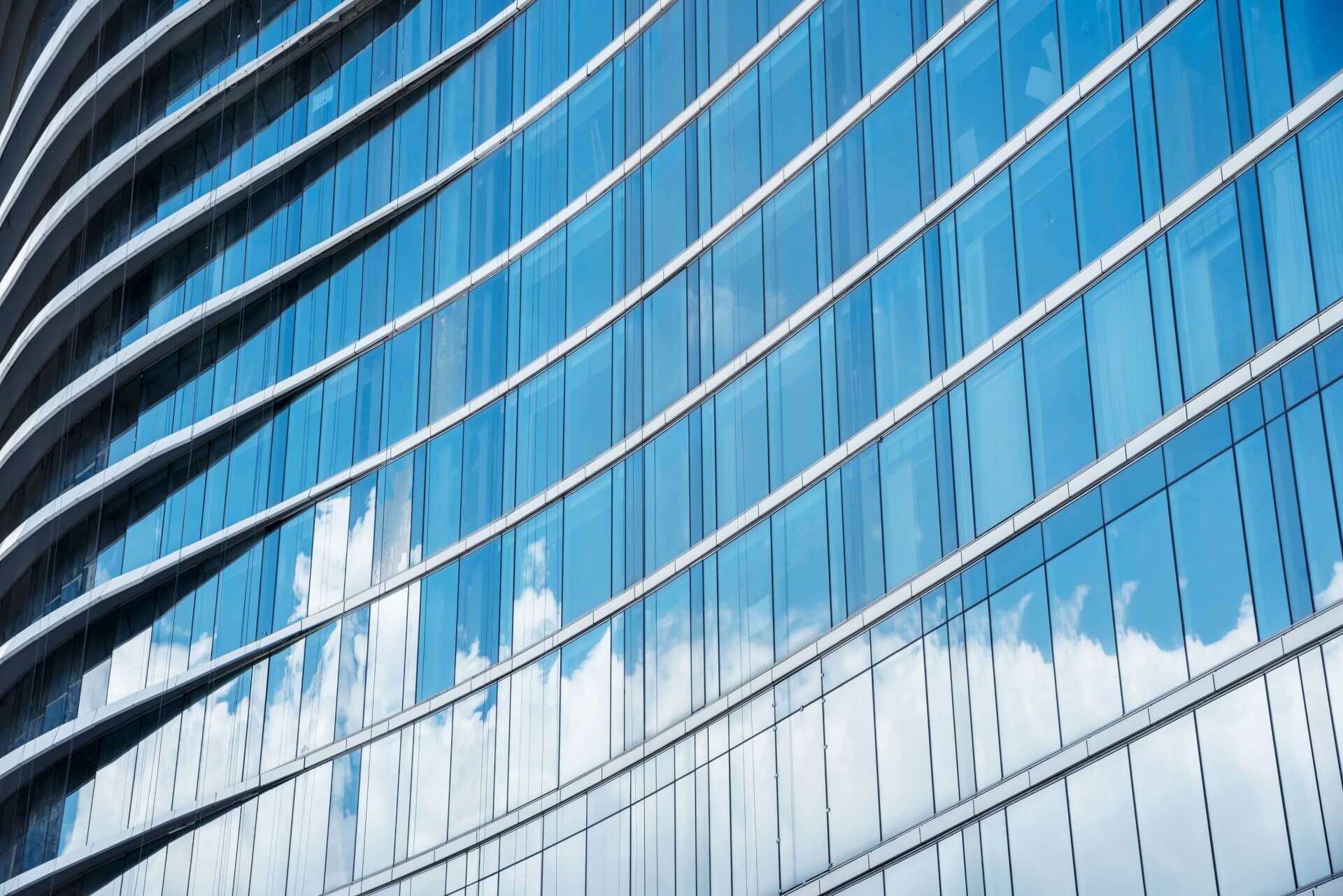Blue glass curtain wall on a commercial building