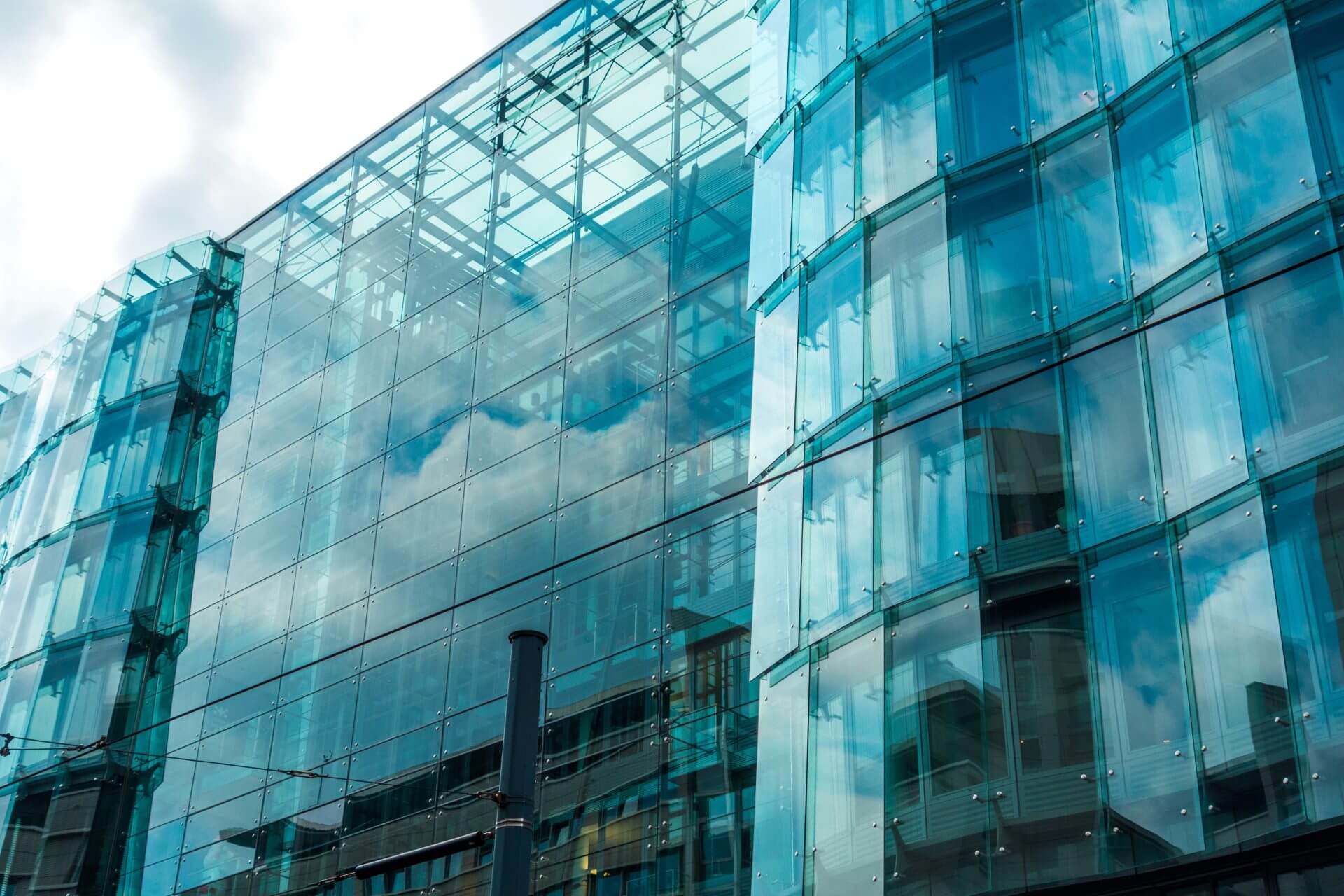Sunlit glass curtain wall on a commercial building