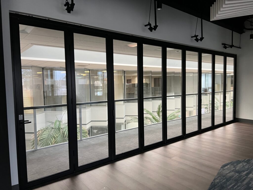 Black-framed interior glass wall in a lounge