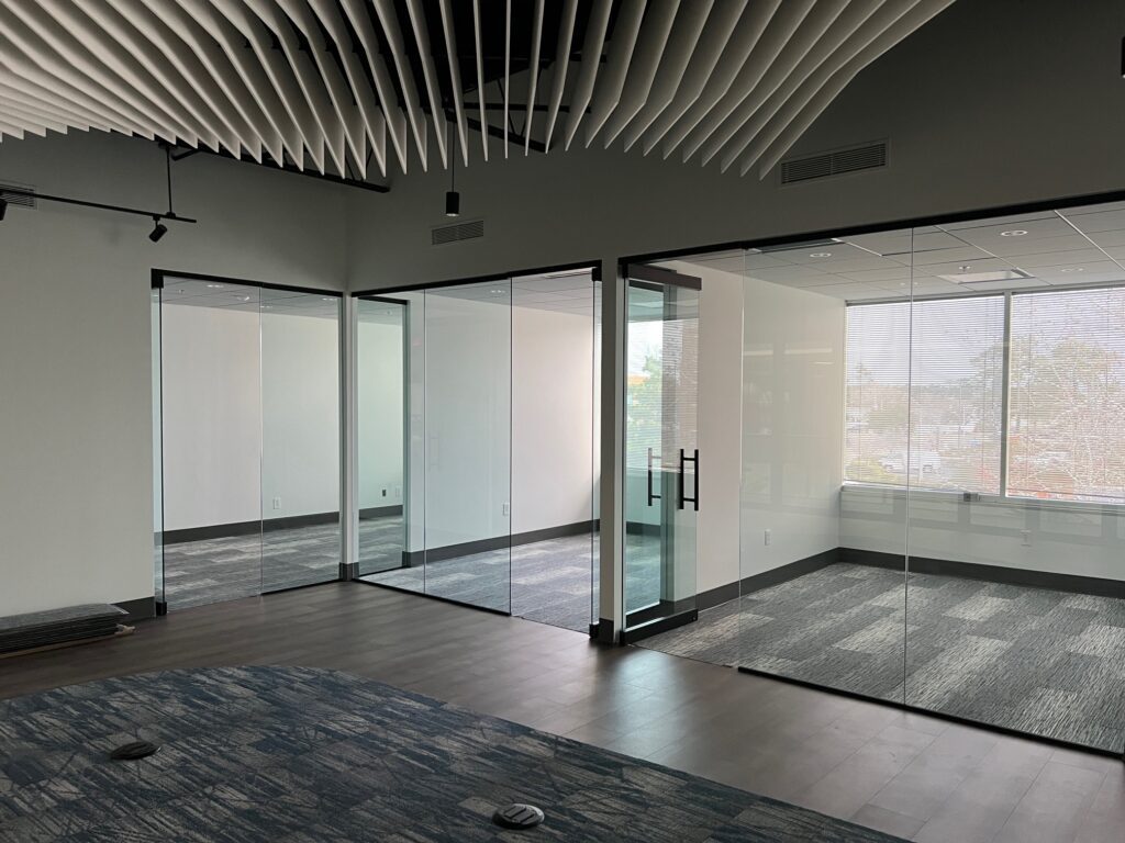 Frameless glass partitions in an open-plan office