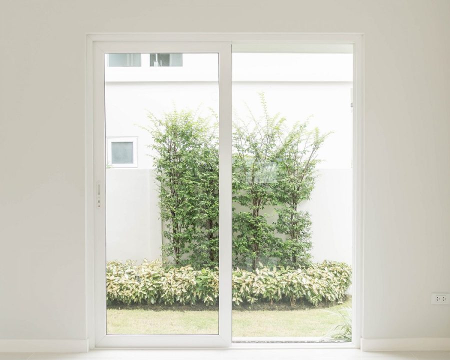 Residential sliding glass door opening onto a garden